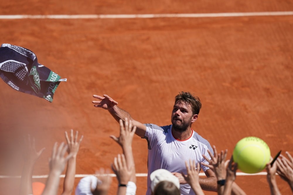 2015 champion beats Grigor Dimitrov in three tantalisingly tight sets.